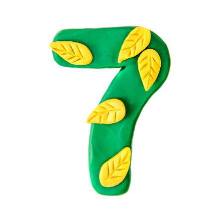 Plasticine green number 7 with yellow autumn leaves, isolate on white background