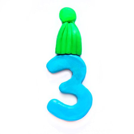 Plasticine blue number Three in green winter hat on white background