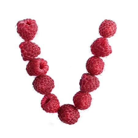 The letter V of the english alphabet of red ripe raspberries,, isolate on a white backgroundの写真素材