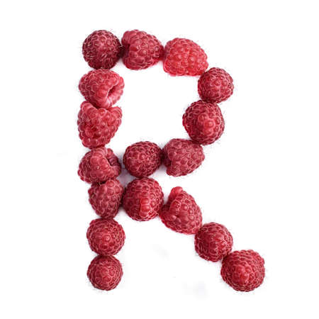The letter R of the english alphabet of red ripe raspberries,, isolate on a white backgroundの写真素材