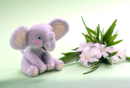 Cute funny little toy handmade woolen elephant, felting from woolの写真素材