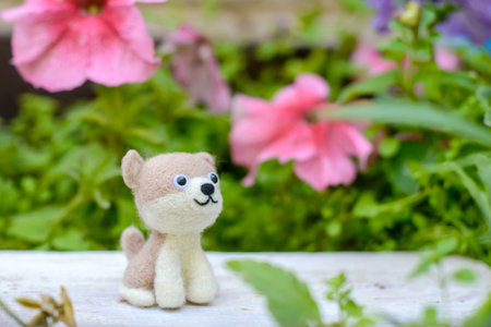 Cute funny little toy handmade woolen dog, felting from woolの写真素材