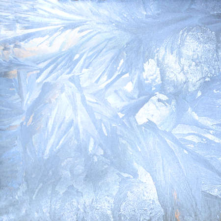 Picturesque frosty patterns on the winter window. Square abstract backgroundの写真素材