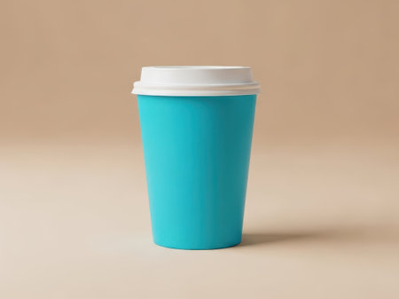 Blue disposable coffee cup with lid isolated on white backgroundの素材
