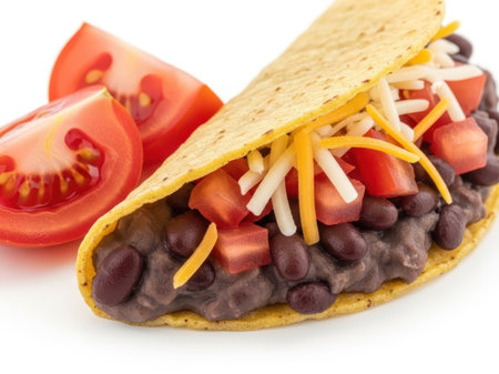 Taco with beans, cheese, and tomatoes isolated on white backgroundの素材