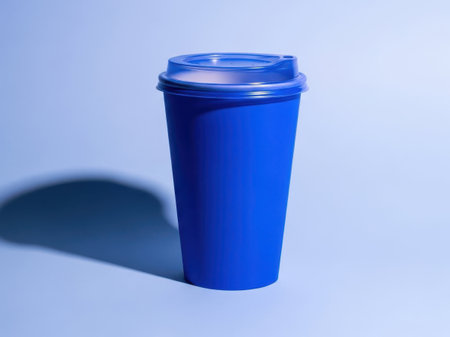 Blue disposable coffee cup isolated on white backgroundの素材