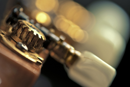 a superb close-up of classic guitar tuning mechanism  pegs  wheels  cog-wheelsの写真素材