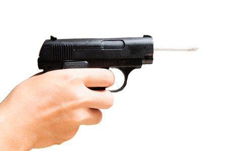 Cigaret and gun people body part danger concept isolatedの写真素材