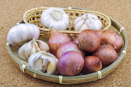 Red onions with garlic on wooden backgroundの写真素材