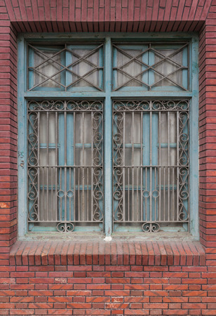 wooden window on vintage red brick wallの写真素材