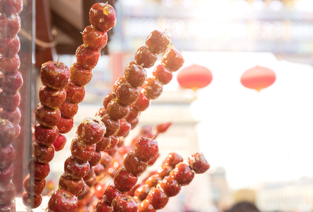 Sugarcoated haws on a stick