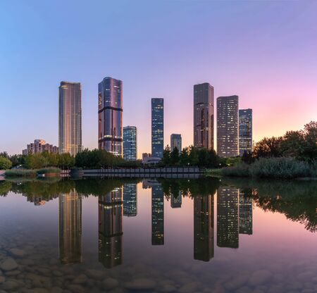 Lakeside modern office building reflection on the waterの写真素材
