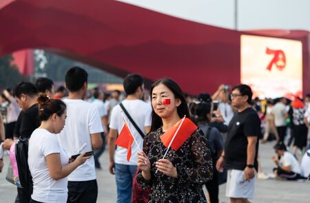 BEIJING-October 3: Celebrate the national day on October 3, 2019 in Beijing, China. People celebrating China National Day in Tiananmen Square.のeditorial素材