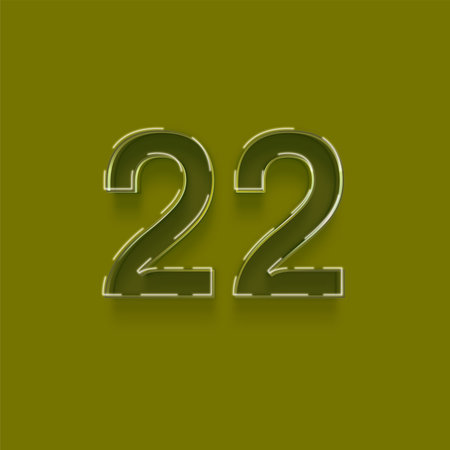 Glossy metal number 22, twenty two, isolated on green background.の写真素材