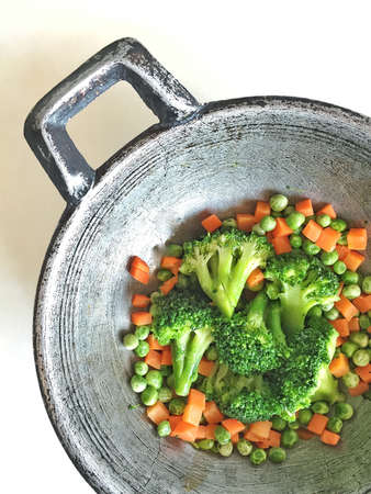 Mix vegetables fried in iron pan.の素材