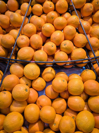 Mandarins on slate in market, Fresh harvestedの写真素材