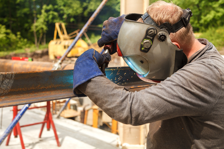 Worker welding in a factory. Welding on an industrial plant.の写真素材
