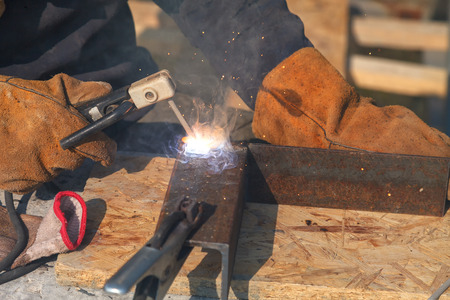 Welding work, welder welding metal material in heavy industry manufacturingの写真素材