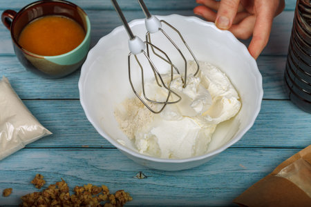 Egg whites beaten to a frothy stage. Finished beating egg white to meringue at stiff peaks