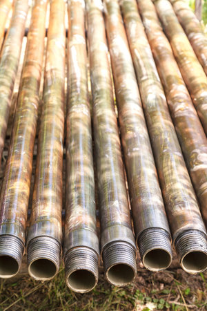 Metal construction for further use in the vineyard. The pipes are painted red with primer. Metal...