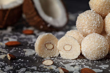 Delicious raspberry cake with cream and decorated with fresh raspberry berries and mint leaves. Fork break off part of the cakeの写真素材