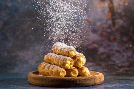 Delicious puff pastry tubes filled with custard. Powdered Sugar