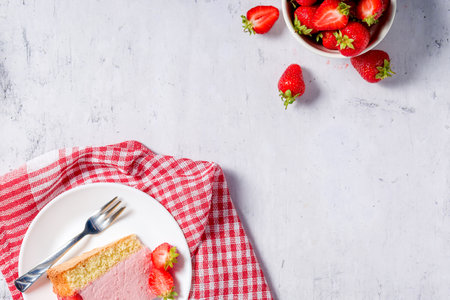 Strawberry cake. Menu concept. Homemade strawberry cake decorated with strawberries and mint leaves. Copy spaceの写真素材