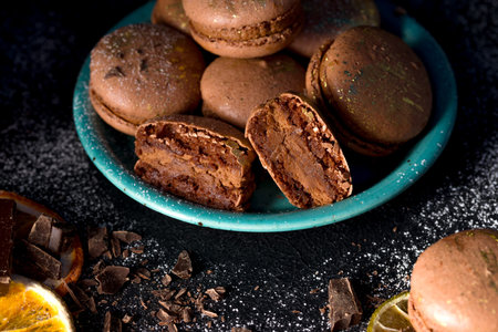 Macaroons with chocolate cream on a dark background.の写真素材