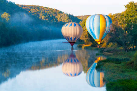 air balloons over the riverの写真素材