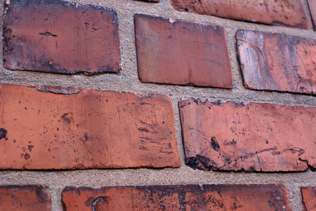 Several bricks and mortar in a wall