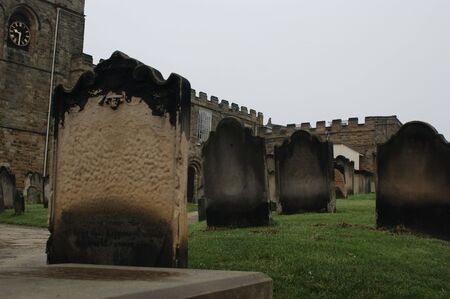 A row of weathered gravestonesの写真素材