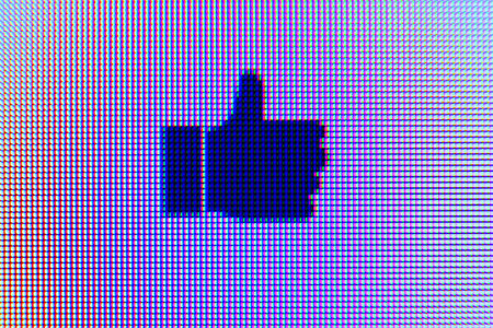 Macro Thumbs Up on Computer screen