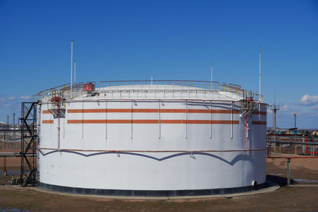Tank for storing oil, gas and gasoline at an oil refinery. Oil pipeline ..