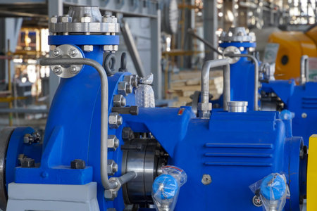 An industrial pump for pumping oil and gas stands on a foundation at a production site in Russia