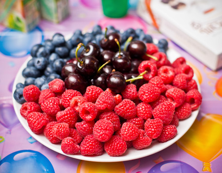 Mix fresh berries on a plate, food closeupの写真素材