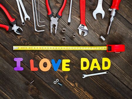 I love Dad. Letters and tools on a wooden background.の写真素材