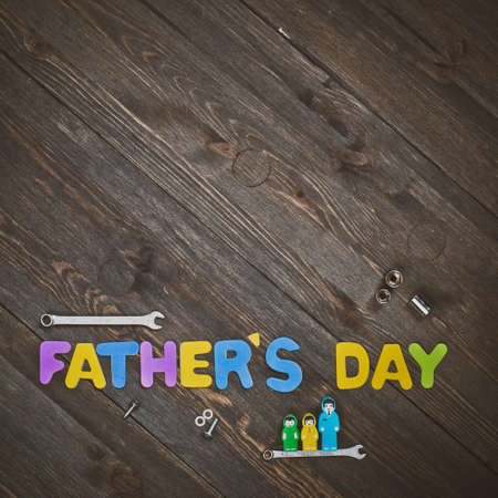 Fathers day. Letters and tools on a wooden background.の写真素材