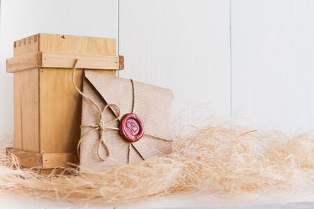 and sending a love letter on a white wooden backgroundの写真素材