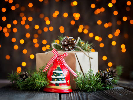 gift decorated with pine cones on the wooden backgroundの写真素材