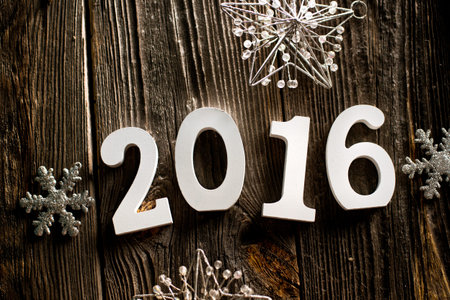 Room 2016 on the wooden background with Christmas decorations