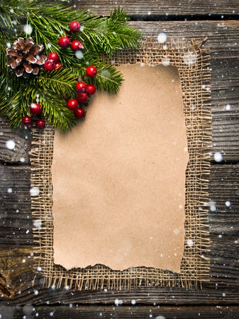 blank sheet for New Year's greetings decorated Christmas tree and pine conesの写真素材