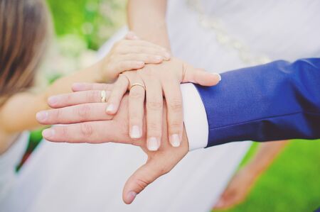 Family holding hands together closeup.の写真素材