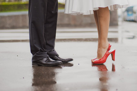 Feet in footwear of the groom and the brideの写真素材