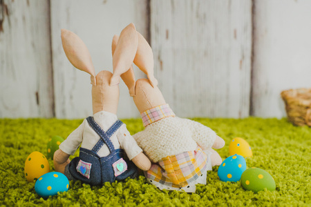 pair of easter bunnies sitting on the grassの写真素材