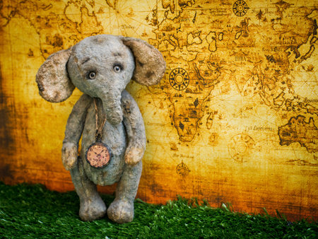 Plush toy on the background of the world mapの写真素材