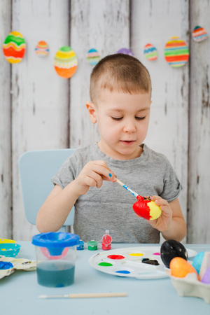 Baby Painting Easter Eggsの写真素材