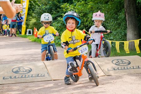 Russia. Moscow. Vorontsovsky Park on the 21st of August. STRIDER CUB 2016. Racing on the balance bikeのeditorial素材