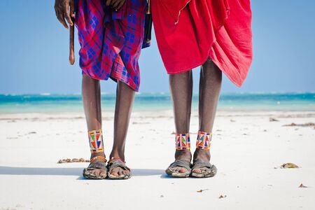 feet men the Masai tribe in shoes made of car tires on the backdrop of the oceanの写真素材
