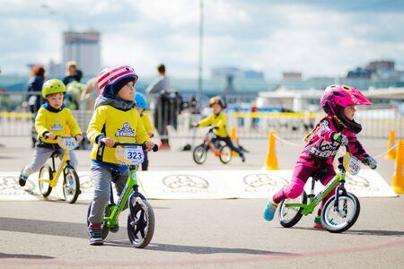 Russia, Moscow, Gorky Park, September 09, 2017. Childrens bike ride. Children from 2 years to 7 in helmets compete in bike races, balance bike, run bikeのeditorial素材