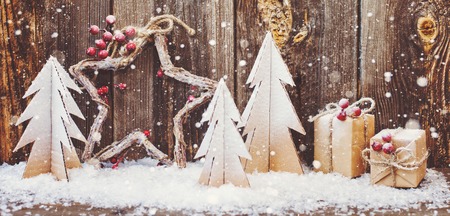 Christmas decoration over wooden background for congratulationsの写真素材